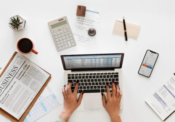 aerial-view-businessman-using-computer-laptop-1-e1646166176490
